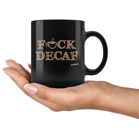 Image of a hand holding a black coffee mug featuring the Caffeiniac F_CK DECAF design on front and back.