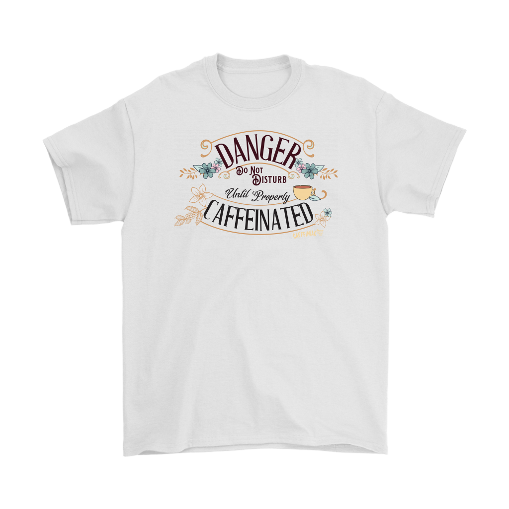 a men's white t-shirt featuring the Caffeiniac design "Danger Do Not Disturb Until Properly Caffeinated".