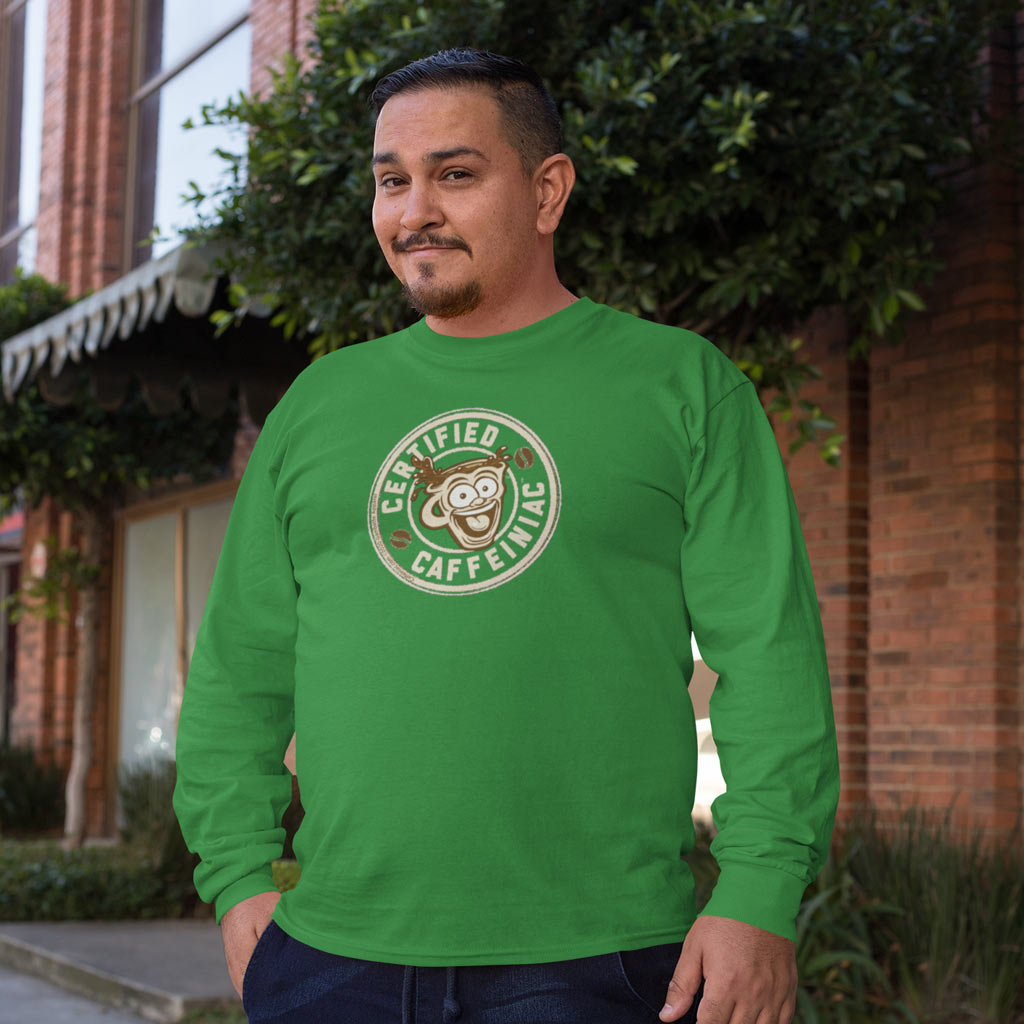 Smiling man wearing green long sleeve t-shirt with the Certified Caffeiniac design in tan ink