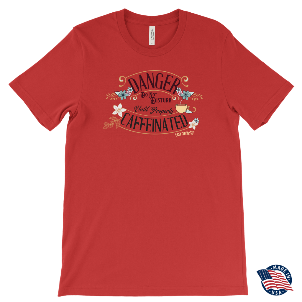 men's red t-shirt featuring the Caffeiniac design "Danger Do Not Disturb Until Properly Caffeinated".