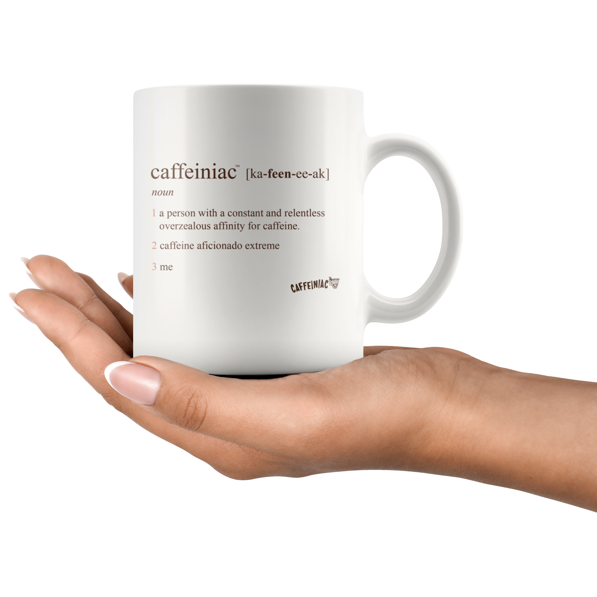 a woman holding a white 11oz coffee mug with the original Caffeiniac defined design in brown ink