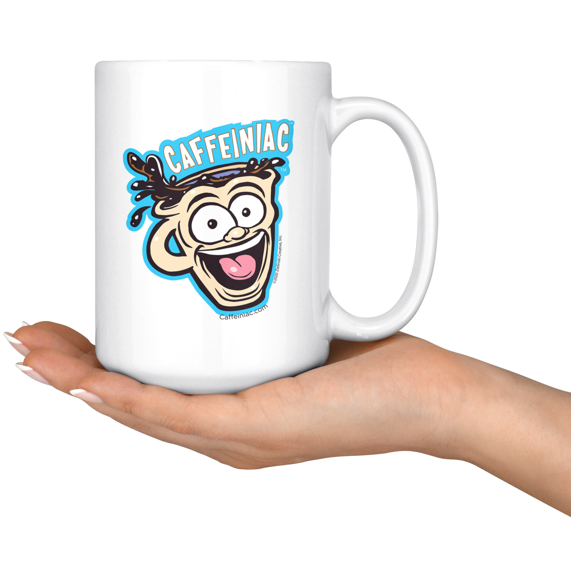 front view of a white ceramic coffee mug with a vibrant Caffeiniac design which is printed on both sides resting on the palm of a woman's hand