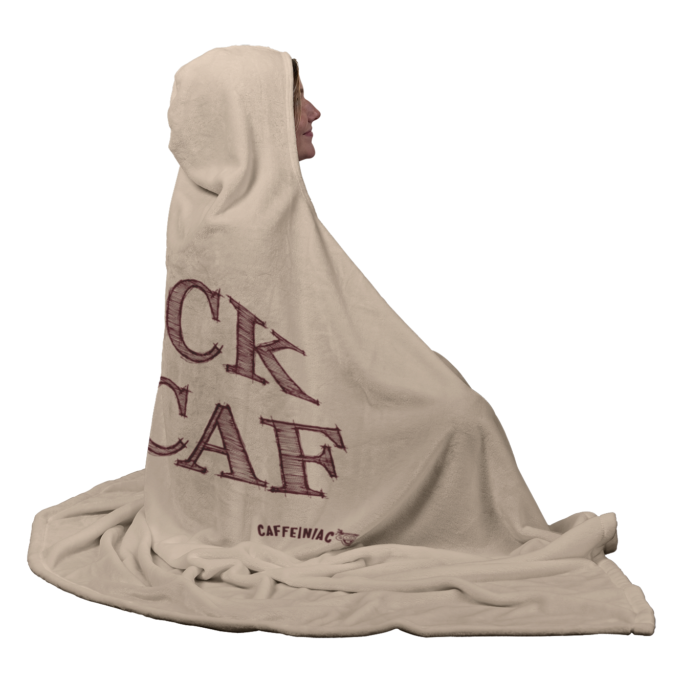 smiling woman sitting wearing a luxurious hooded blanket featuring the Caffeiniac design F_CK DECAF