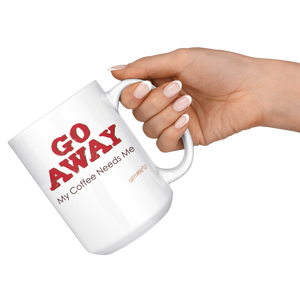 a hand holding a white ceramic coffee mug by the handle with the Caffeiniac design GO AWAY My Coffee Needs Me on both sides