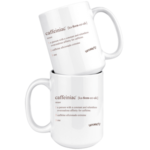 two stacked  white coffee mugs with the original Caffeiniac defined design in brown ink