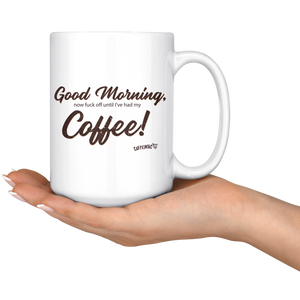 a woman holding a 15oz white coffee mug with the original Caffeiniac design Good Morning, now fuck off until I've had my Coffee