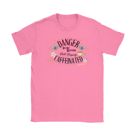 Image of a women's pink t-shirt featuring the Caffeiniac design DANGER do not disturb until properly caffeiniated