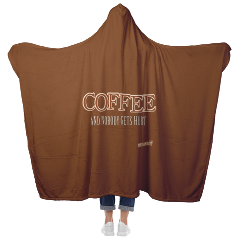 Image of woman standing holding her arms out to show the full back view of a luxurious hooded blanket featuring the Caffeiniac design COFFEE AND NOBODY GETS HURT