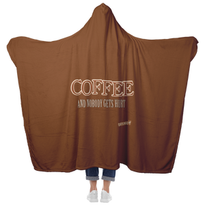 woman standing holding her arms out to show the full back view of a luxurious hooded blanket featuring the Caffeiniac design COFFEE AND NOBODY GETS HURT