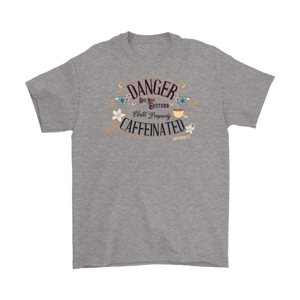 a men's grey t-shirt featuring the Caffeiniac design "Danger Do Not Disturb Until Properly Caffeinated".