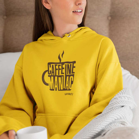 Image of woman wearing a yellow hoodie by Caffeiniac featuring the design CAFFEINE MANIAC on the front