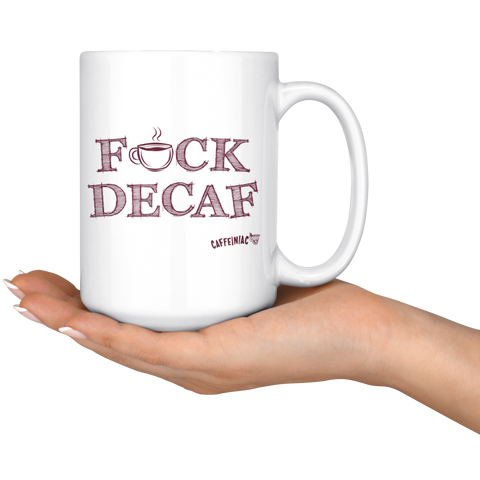 Image of a woman's hand holding a white 15oz coffee mug featuring the Caffeiniac F_CK DECAF design on front and back.