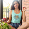 Woman sitting enjoying fresh fruit wearing a turquoise tank top featuring the Certified Caffeiniac design on the front 
