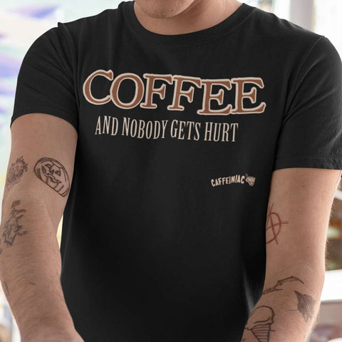 Image of a tattooed man wearing a black shirt with an original Caffeiniac design COFFEE AND NOBODY GETS HURT