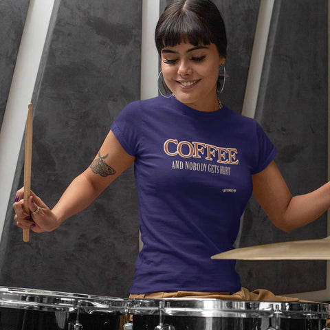 Image of woman playing the drums wearing a purple shirt featuring the original Caffeiniac design COFFEE AND NOBODY GETS HURT