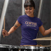 woman playing the drums wearing a purple shirt featuring the original Caffeiniac design COFFEE AND NOBODY GETS HURT