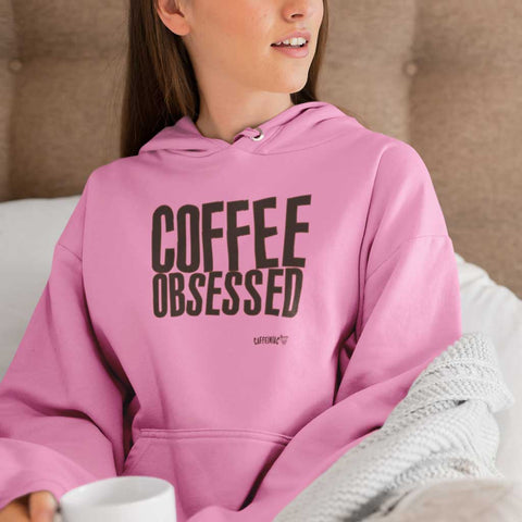 Image of pink hoodie featuring the COFEE OBSESSED design on the front