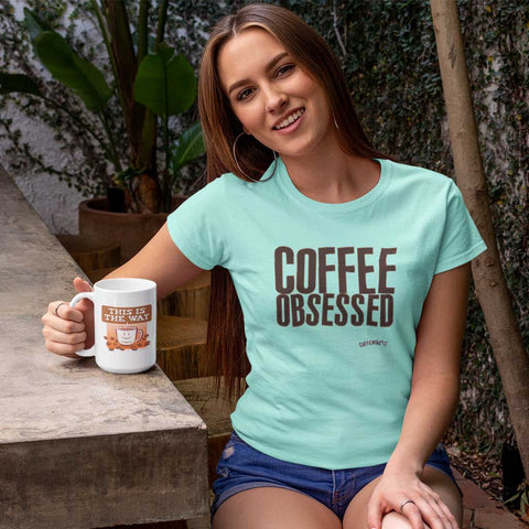 Image of smiling woman wearing a caffeiniac coffee obsessed shirt