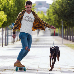 A man skating with his dog