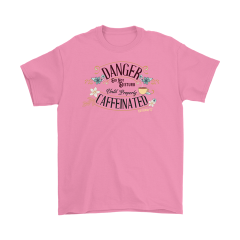 Image of a men's pink t-shirt featuring the Caffeiniac design "Danger Do Not Disturb Until Properly Caffeinated".