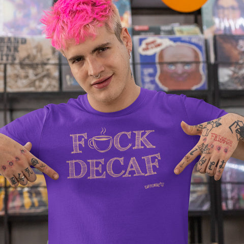 Image of young tattooed man with pink hair in a record store wearing a purple t-shirt with the Caffeiniac design F_ck Decaf in tan ink