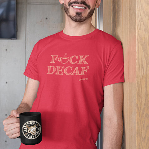 Image of man leaning against wall holding a certified Caffeiniac coffee cup wearing a red t-shirt with the original caffeiniac design F_CK DECAF