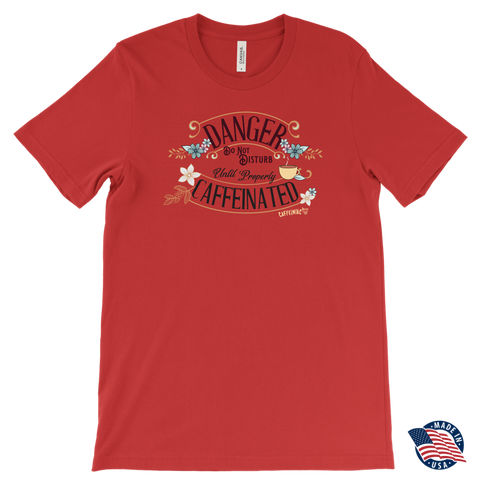 Image of  men's red t-shirt featuring the Caffeiniac design "Danger Do Not Disturb Until Properly Caffeinated".