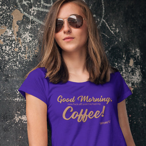 Image of Woman standing against a wall wearing a purple Next Level Womens Triblend shirt featuring the Caffeiniac design "Good Morning, now fuck off until I've had my Coffee!"