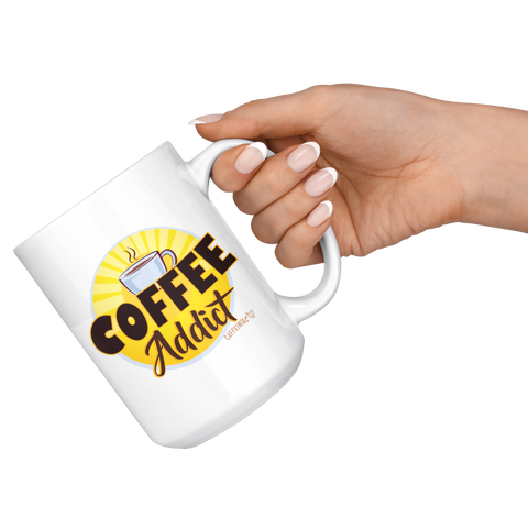 Image of a hand holding  a white ceramic coffee mug with a vibrant Caffeiniac design " Coffee Addict" 