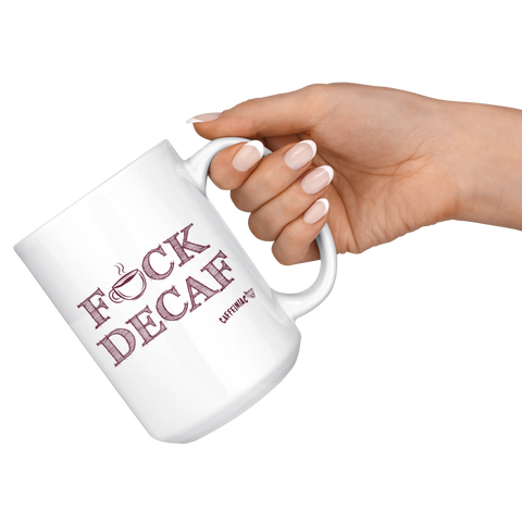 Image of a woman holding a white 15oz coffee mug by the handle featuring the Caffeiniac F_CK DECAF design on front and back.