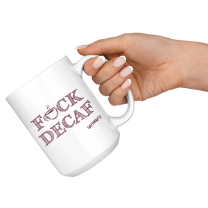 a woman holding a white 15oz coffee mug by the handle featuring the Caffeiniac F_CK DECAF design on front and back.