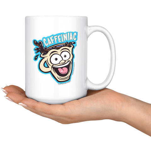 Image of front view of a white ceramic coffee mug with a vibrant Caffeiniac design which is printed on both sides resting on the palm of a woman's hand