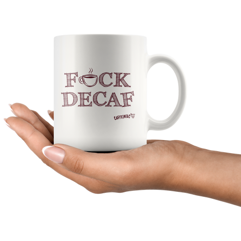 Image of a woman's hand holding a white 11oz coffee mug featuring the Caffeiniac F_CK DECAF design on front and back.