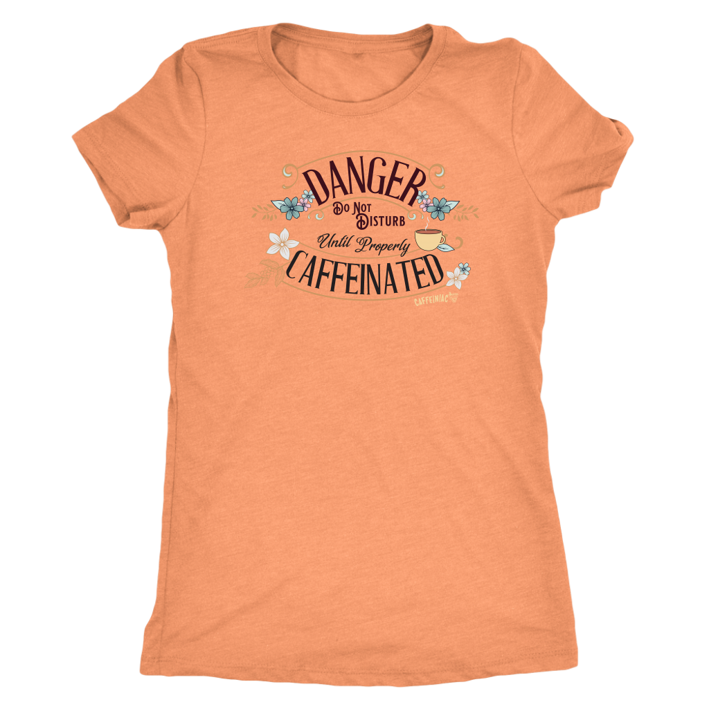 a women's soft orange tee featuring the Caffeiniac design DANGER do not disturb until properly caffeinated