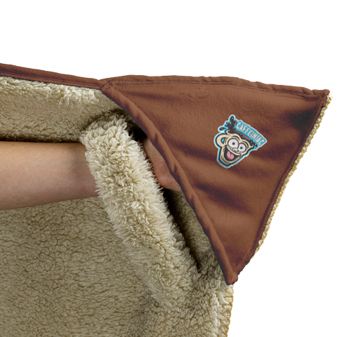 Image of the left glove area of a fleece lined hooded blanket with the Caffeiniac Dude logo on the glove